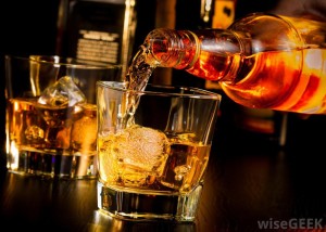 bottle-of-alcohol-poured-into-glass
